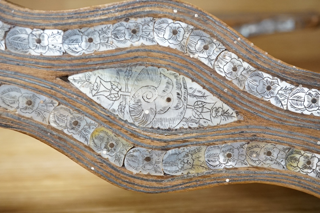 A pair of Islamic wood and engraved mother-of-pearl qabqab (shoes), 25cm wide. Condition - some losses